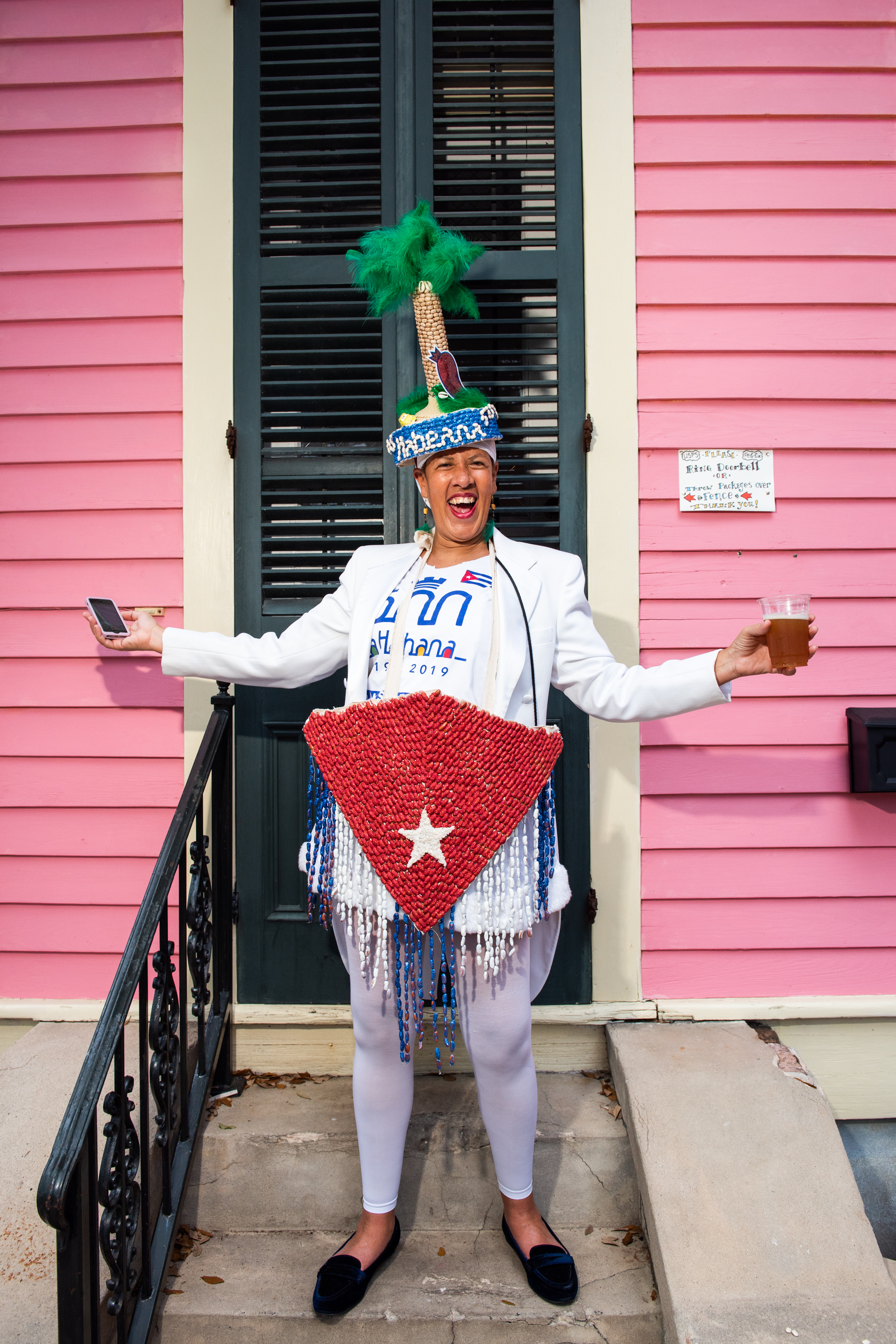 Krewe of Red Beans member in a hand-beaned Cuban flag costume on parade day